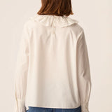 Vue de dos montrant le boutonnage et le col volanté brodé de la blouse Solinette DES PETITS HAUTS