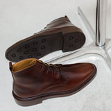 Vue de dessus et de profil des bottines à lacets couleur bison Haïkel BOBBIES HOMME