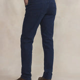Vue de dos du jean slim indigo TBS Benjipoc montrant les poches plaquées et l'élasticité à la ceinture