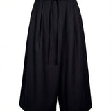 Visuel de face du pantalon court noir à jambes larges LA FÉE MARABOUTÉE Groom avec sa ceinture à nouer