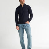 Tenue complète homme avec le pull zippé bleu marine Petrol Industries et un pantalon jean et des baskets blanches