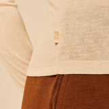 Gros plan sur le jersey fin beige flammé et l'étiquette logo SUN VALLEY