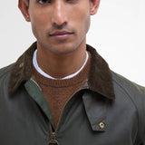 Gros plan sur le col en velours monte et la patte de boutonnage coupe-vent de la veste Barbour